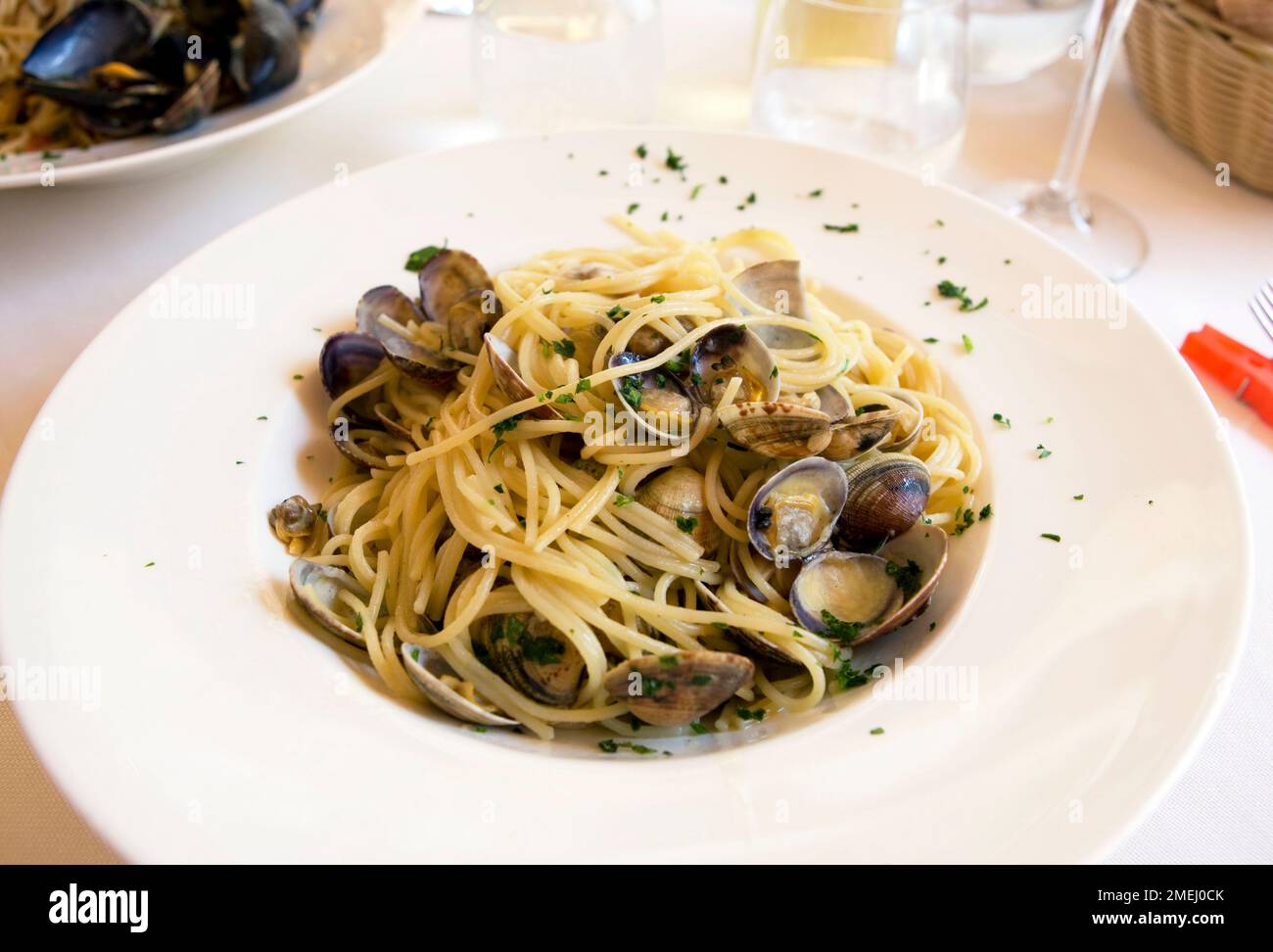 Spaghetti vongole at a restaurant in Marano Lagunare Stock Photo