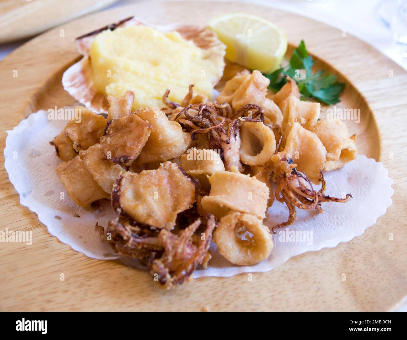 Fried squid at a restaurant in Marano Lagunare Stock Photo