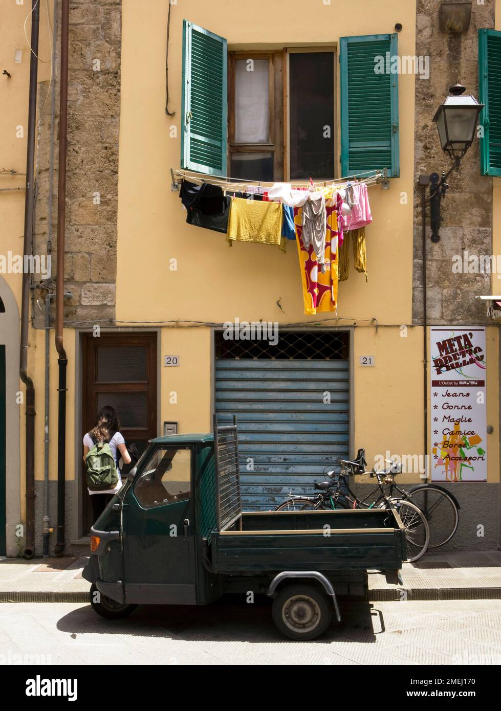 Laundry drying in a back street in Pisa Stock Photo