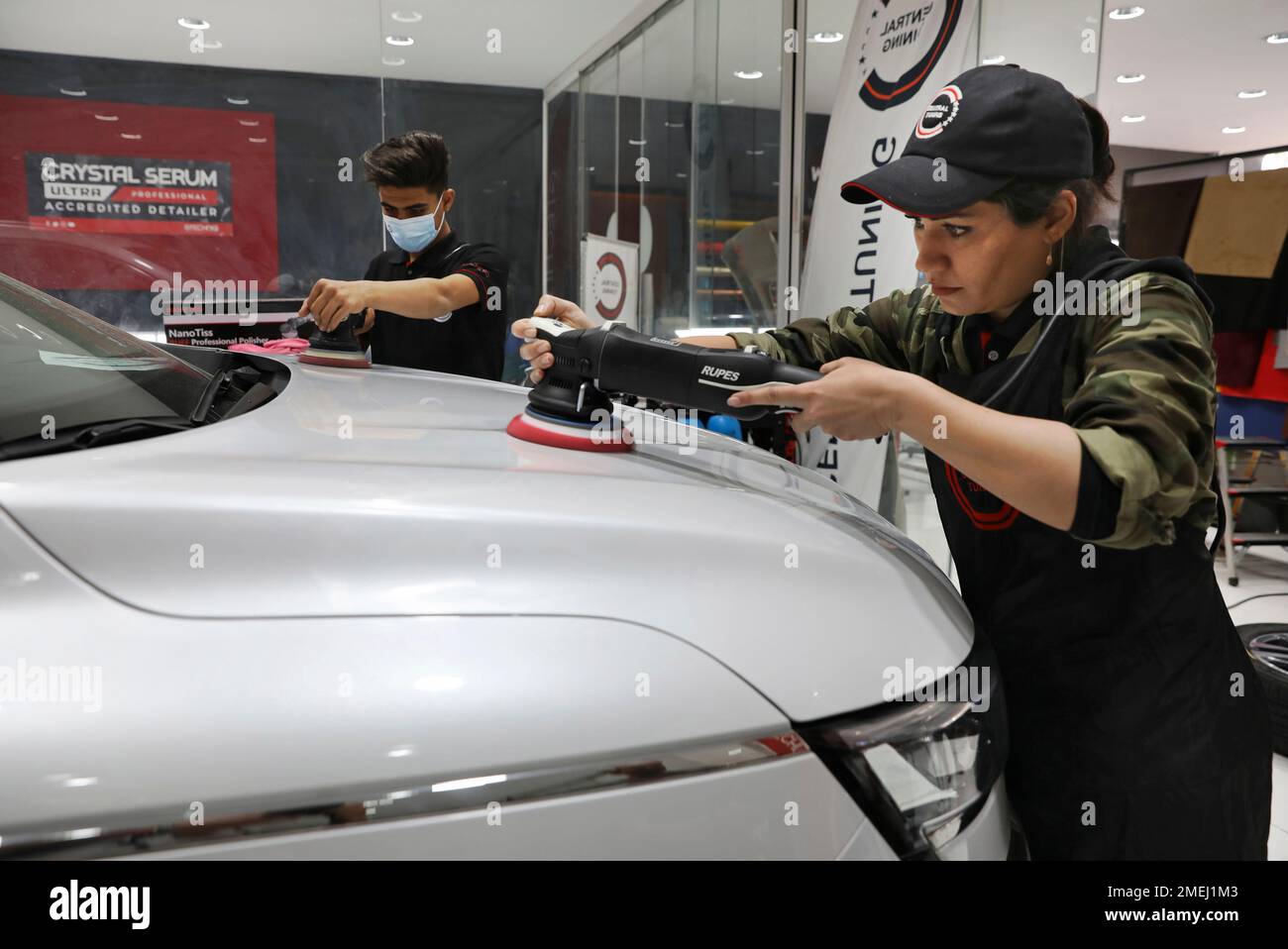 Iranian car detailer Maryam Roohani, right, and her brother Reza