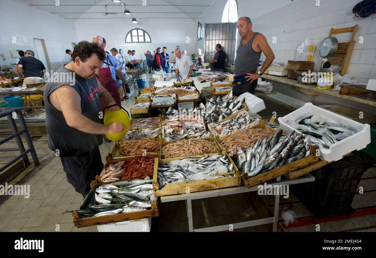 Trapani, Sicily, early morning at the fishing market in the port quarter Stock Photo