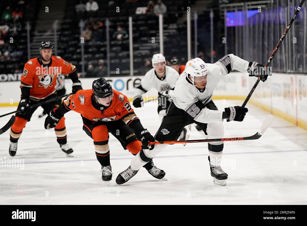 Los Angeles Kings' Quinton Byfield, right, is pressured by Anaheim