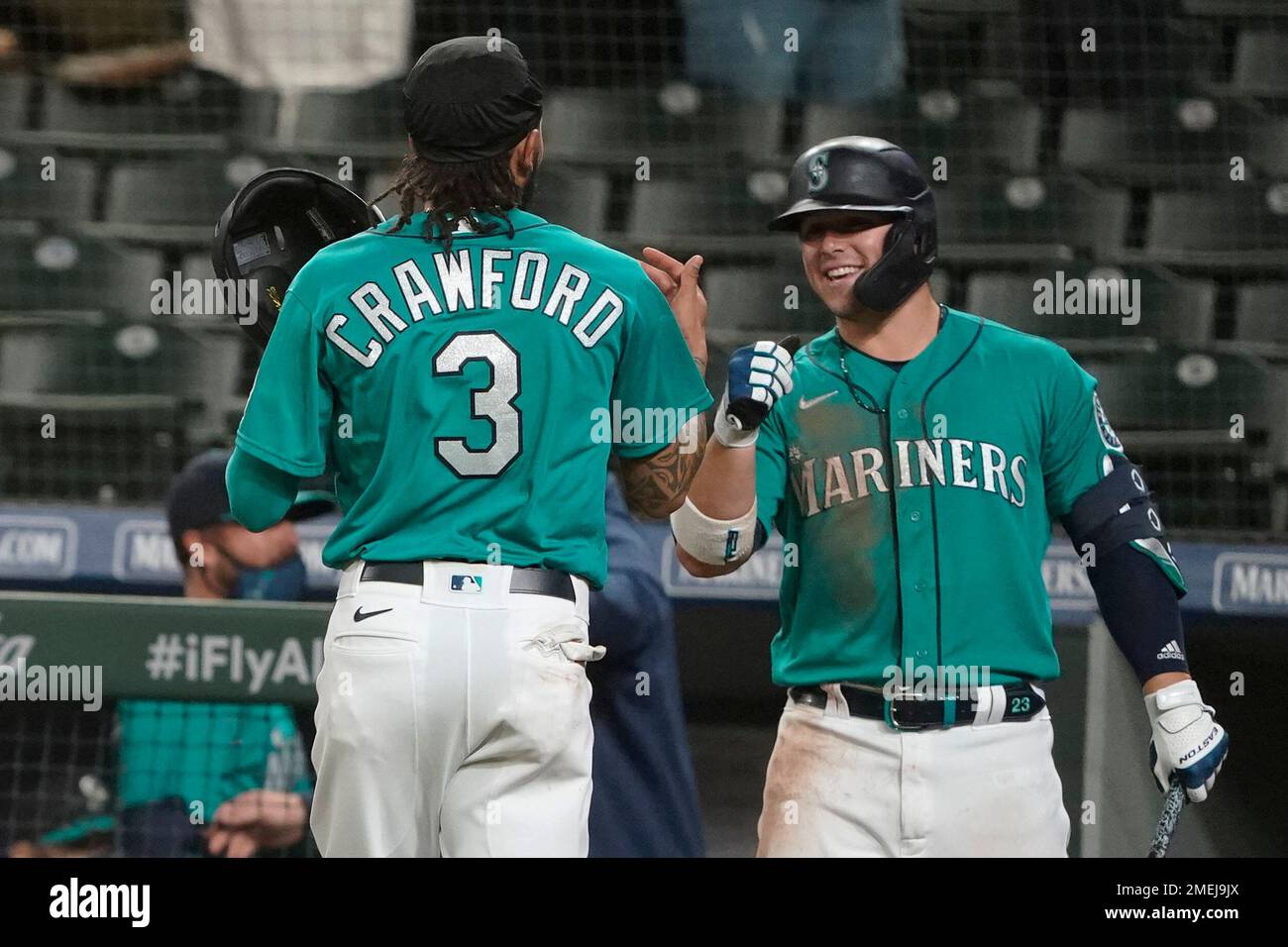 Seattle Mariners' J.P. Crawford (3) is greeted by Ty France after Crawford  scored in the eighth inning of the team's baseball game against the Los  Angeles Angels, Friday, April 30, 2021, in