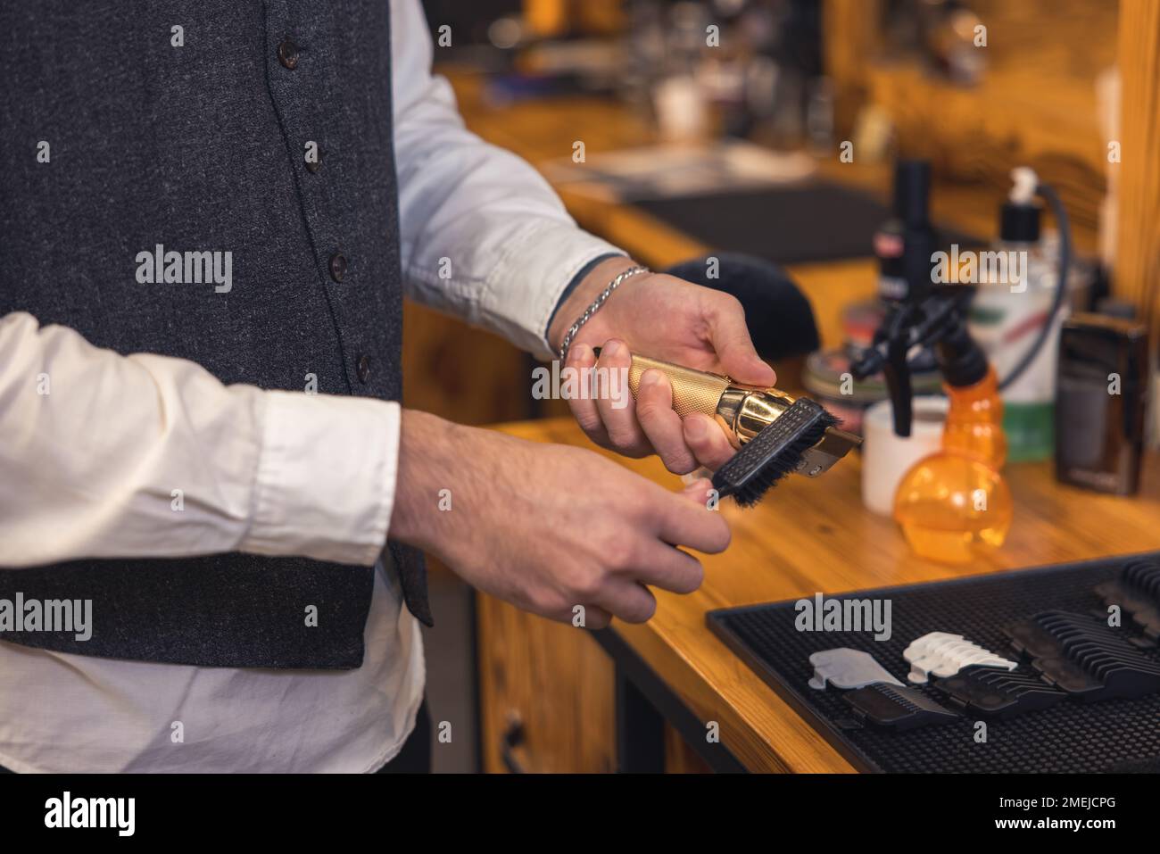 Barber with hairdressing tools an the barbershop Stock Photo