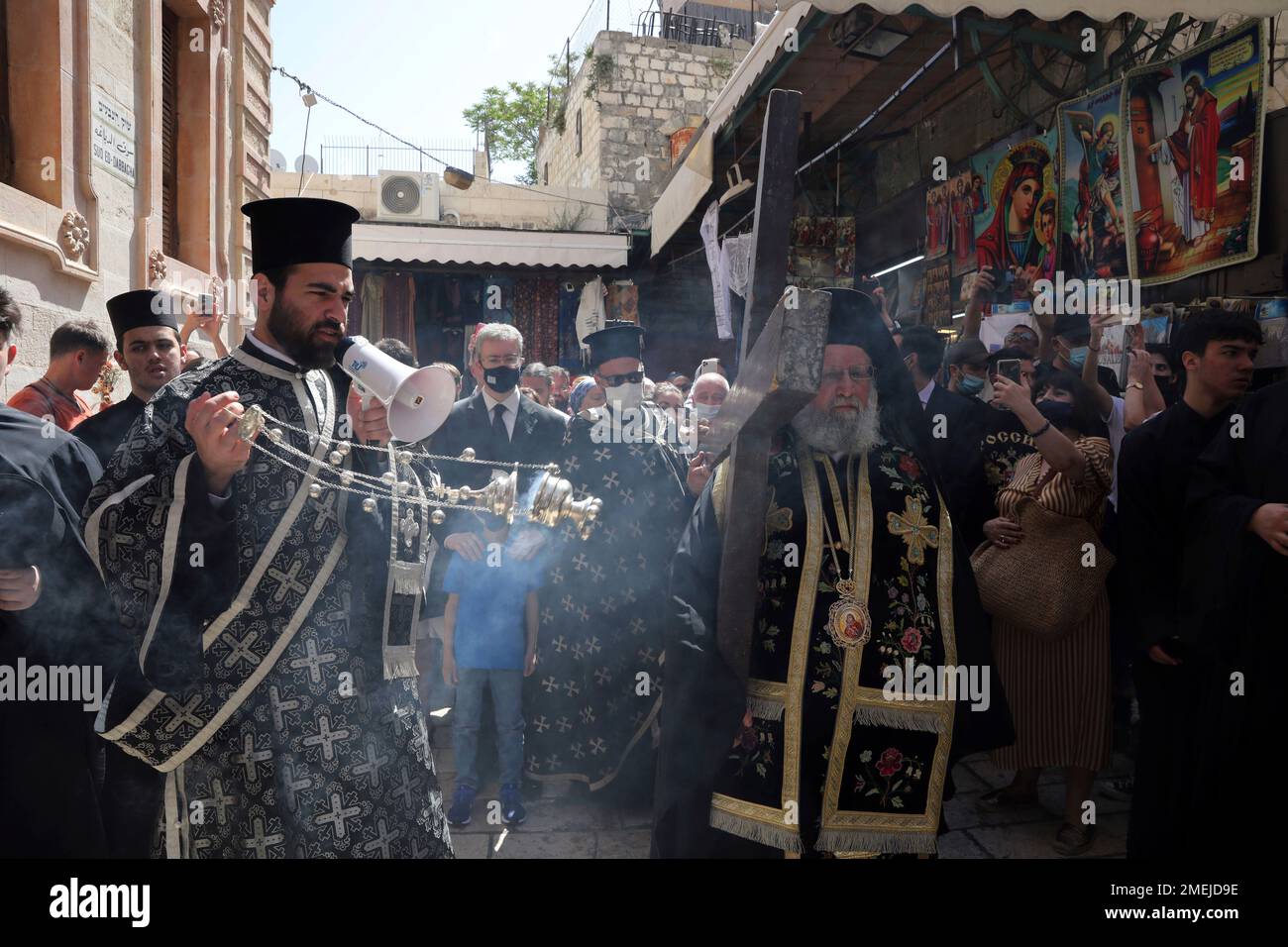 Greek Orthodox Clergy Walk Along The Via Dolorosa During The Good