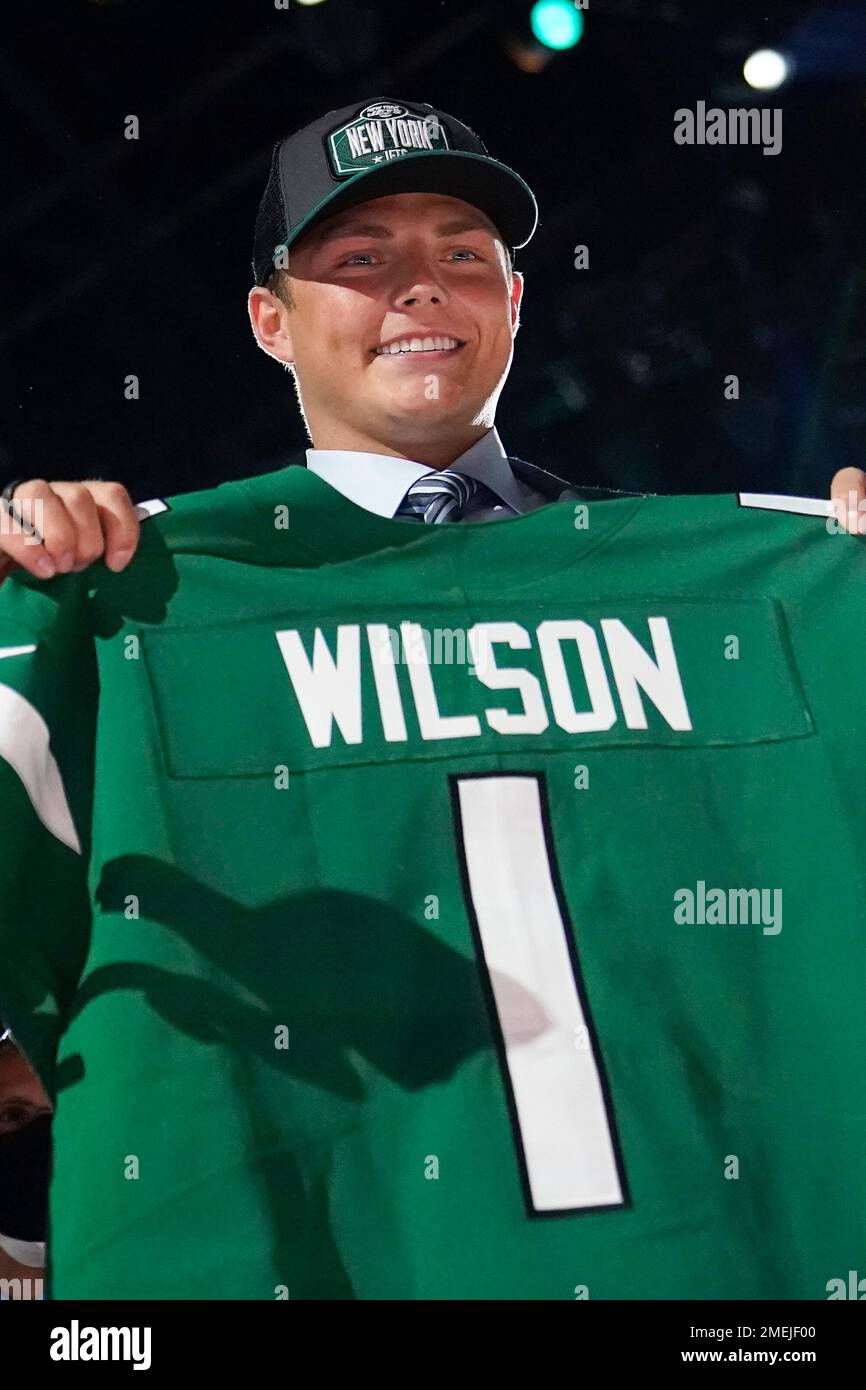 BYU quarterback Zach Wilson holds a New York Jets jersey on stage after  being selected second overall in the first round of the NFL football draft,  Thursday, April 29, 2021, in Cleveland. (