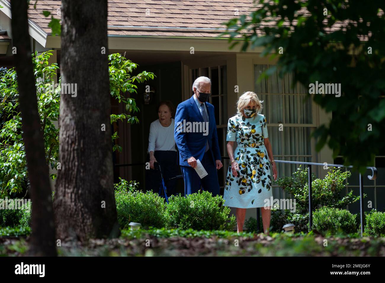 Former first lady Rosalynn Carter looks on as President Joe Biden and