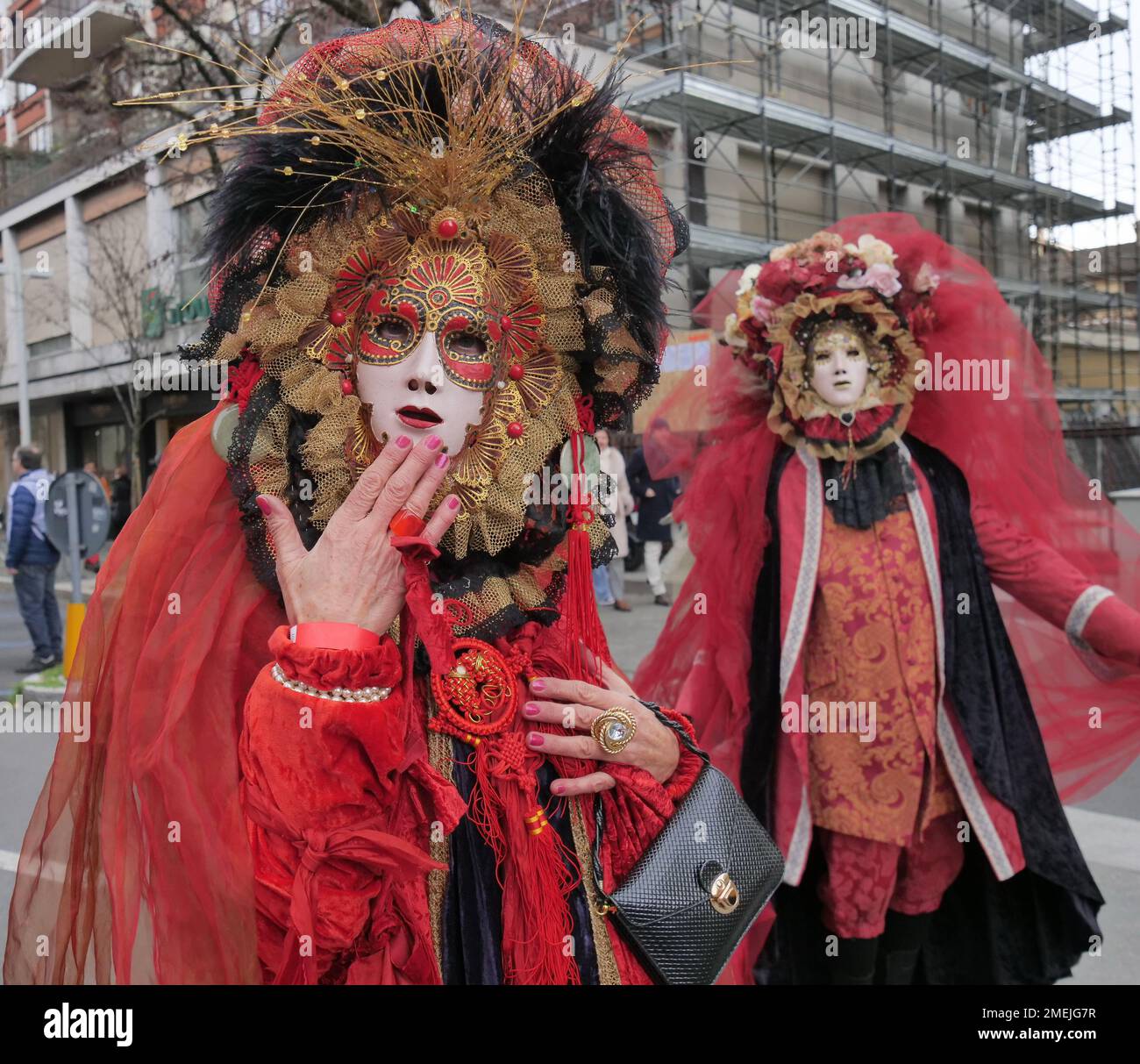 People in carnival outifts posing and walking in streets of the city to celebrate Bergamo Brescia capital of culture 2023 Stock Photo