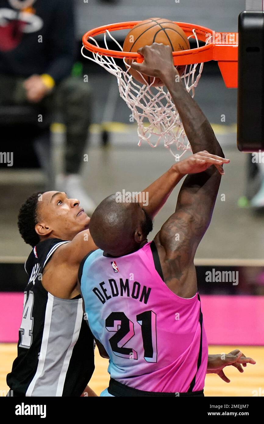 Miami Heat center Dewayne Dedmon (21) dunks as San Antonio Spurs guard Devin  Vassell defends during