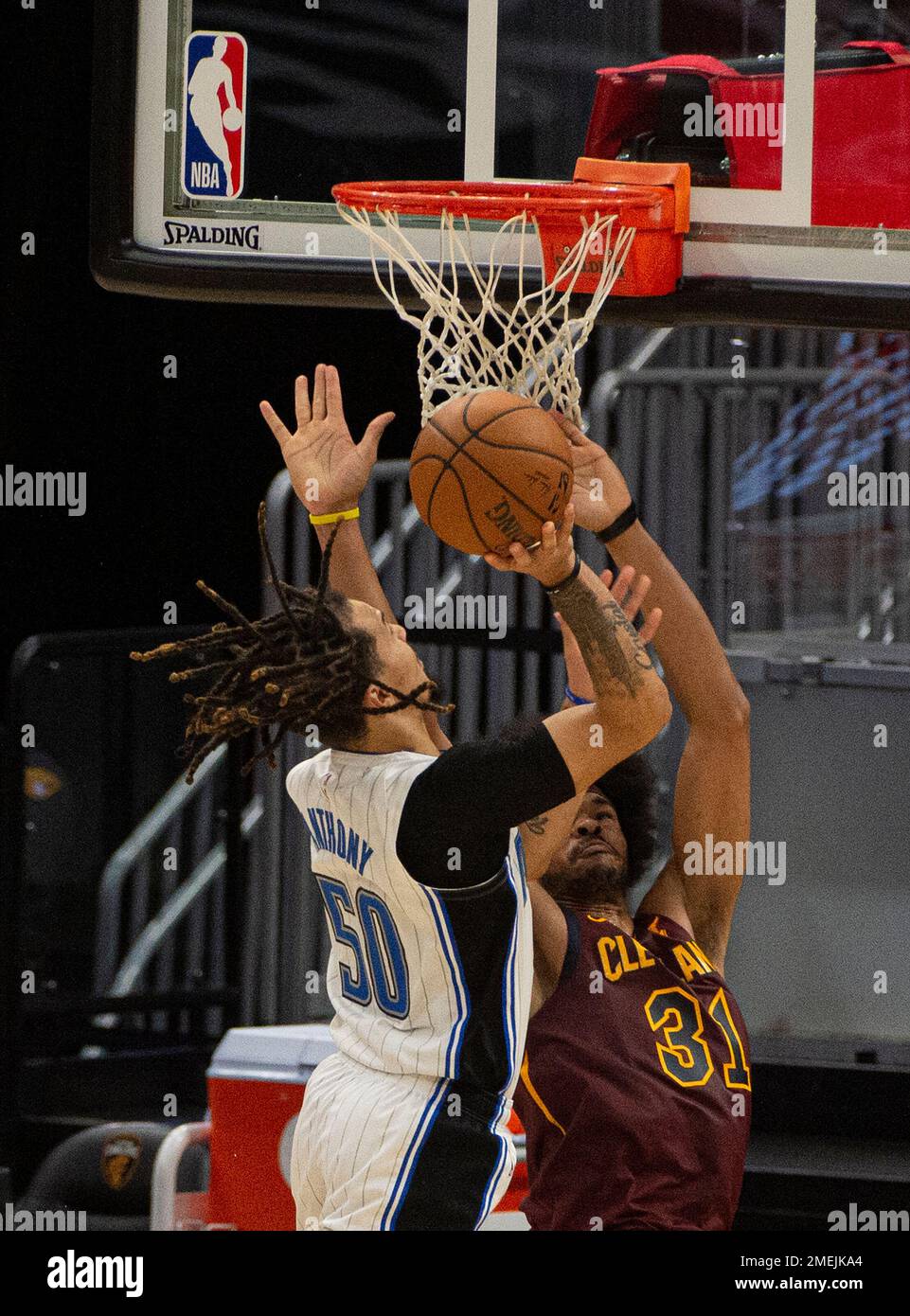 Orlando Magic's Cole Anthony (50) makes a layup over Cleveland ...