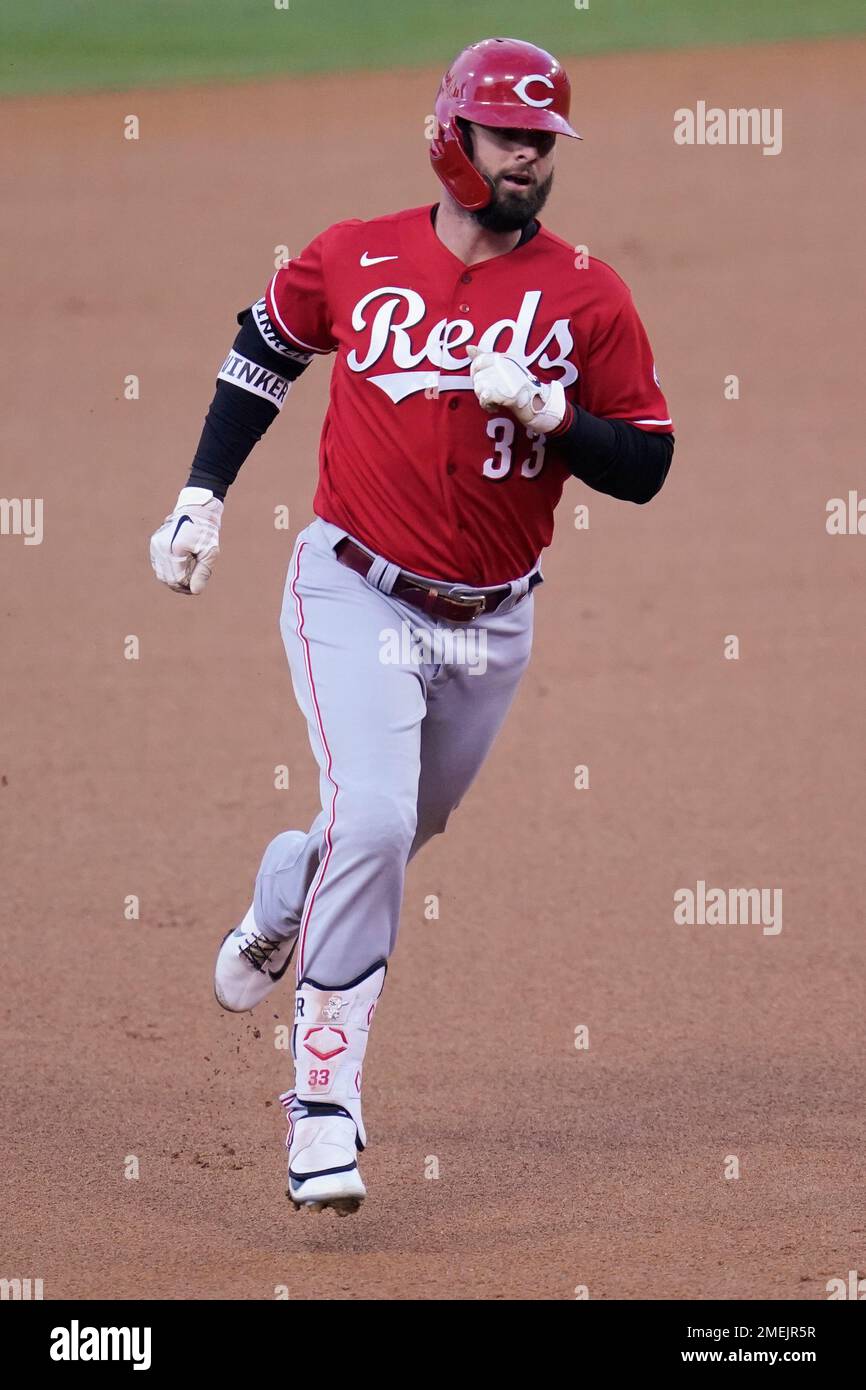 Cincinnati Reds' Jesse Winker (33) runs the bases after hitting a home run  during the first inning of a baseball game against the Los Angeles Dodgers  Tuesday, April 27, 2021, in Los
