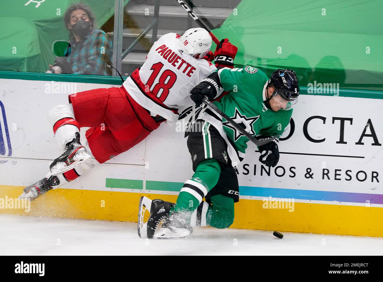 Carolina Hurricanes center Cedric Paquette (18) checks Dallas Stars  defenseman Andrej Sekera (5) against the boards as he attempts to gain  control of the puck in the second period of an NHL