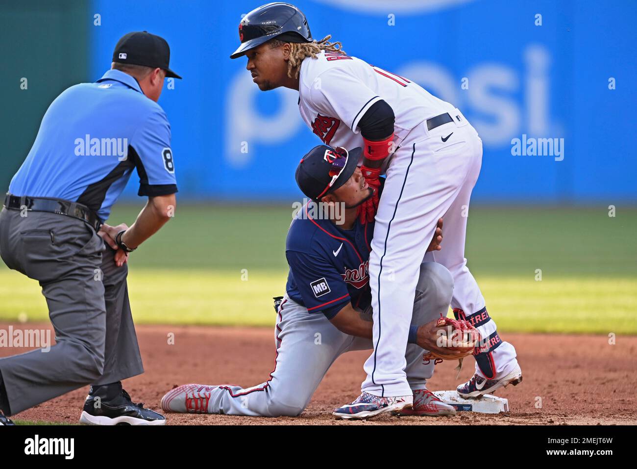 Cleveland Indians' Jose Ramirez, right, runs home to score in