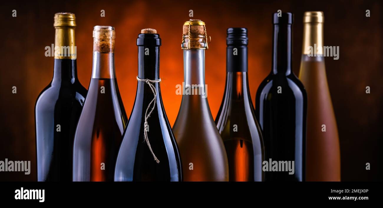 Composition with bottles of different sorts of wine. Stock Photo