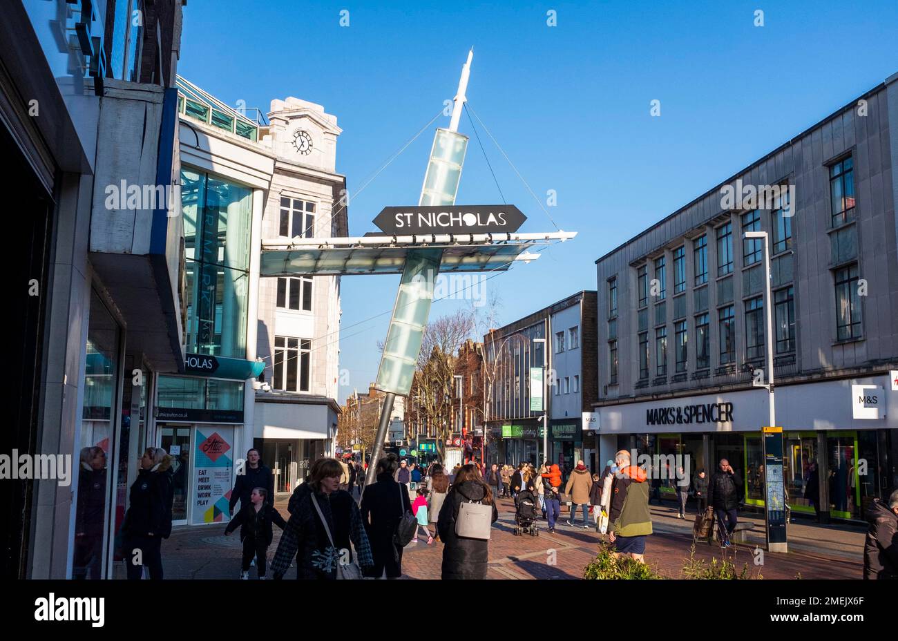 Shoppers walk by the entrance of the St Nicholas shopping Mall in Sutton High Street , Surrey , England UK Stock Photo