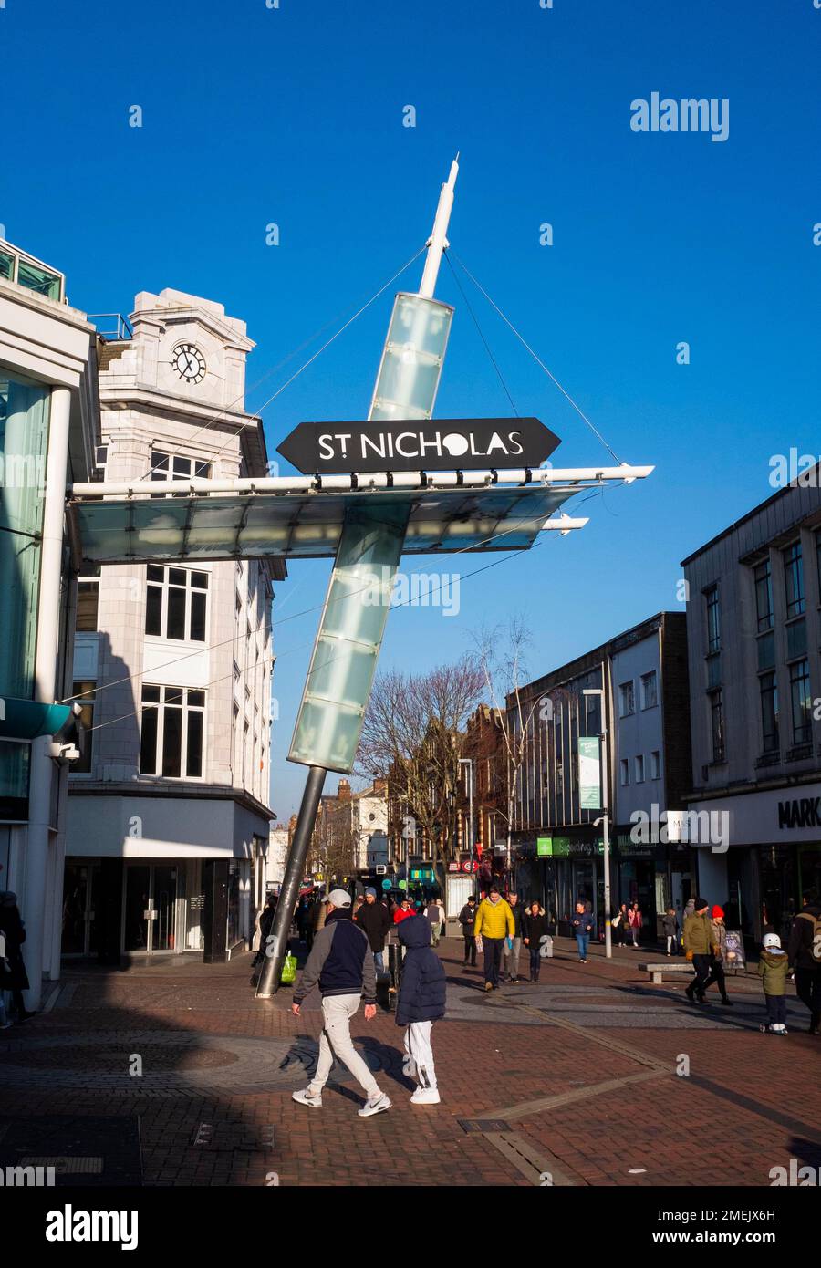 Shoppers walk by the entrance of the St Nicholas shopping Mall in Sutton High Street , Surrey , England UK Stock Photo