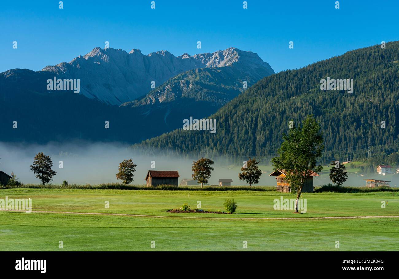 Morning Fog On Wetterstein Mountain, Ehrwald, Tirol, Austria Stock Photo