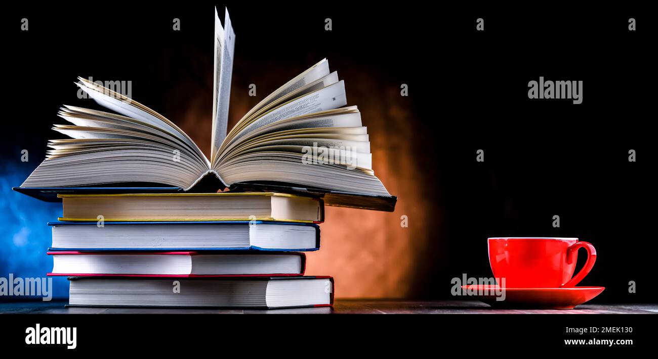 A composition with books and a cup of coffee. Stock Photo