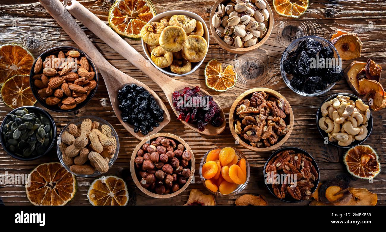 Composition with a variety of dried fruits and assorted nuts. Delicacies. Stock Photo