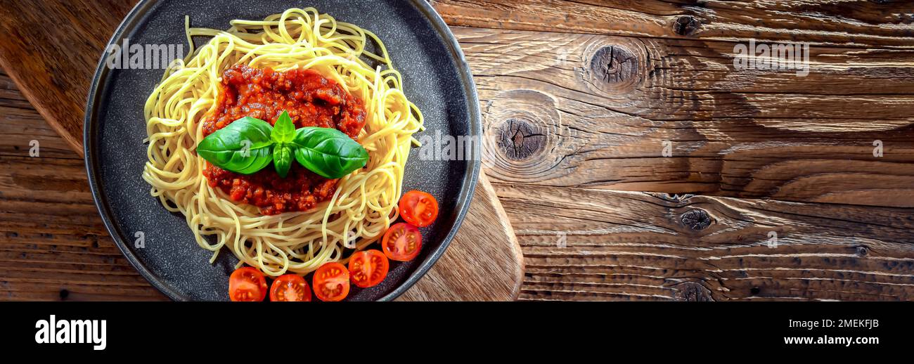 Composition with a plate of spaghetti bolognese. Stock Photo