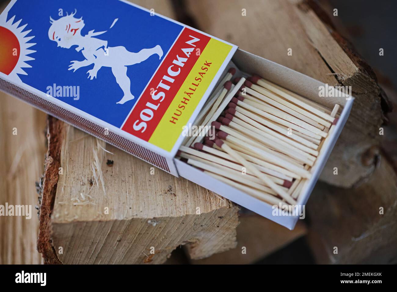 Matches and firewood at a fire place in a home for heating the house