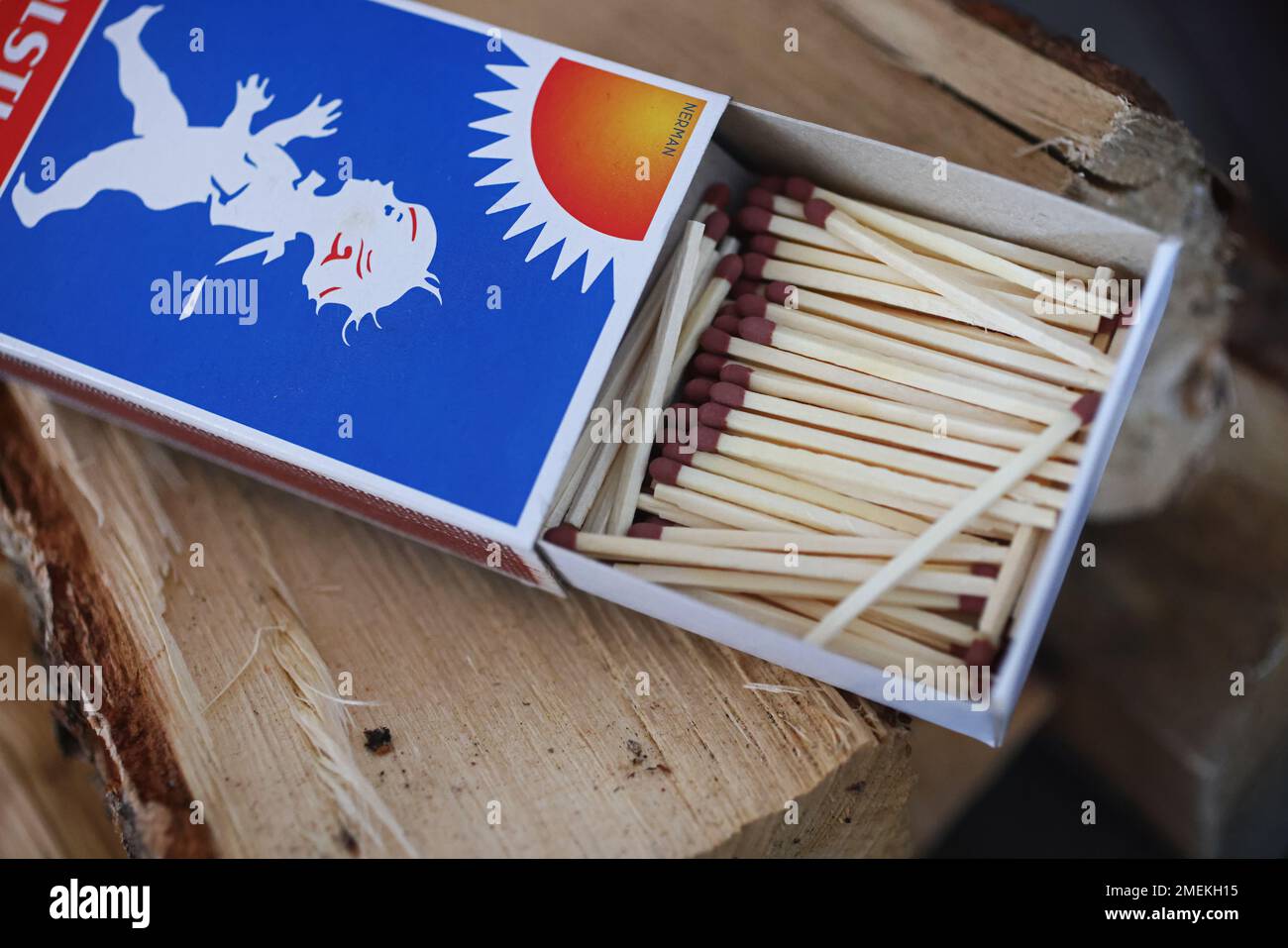 Matches and firewood at a fire place in a home for heating the house