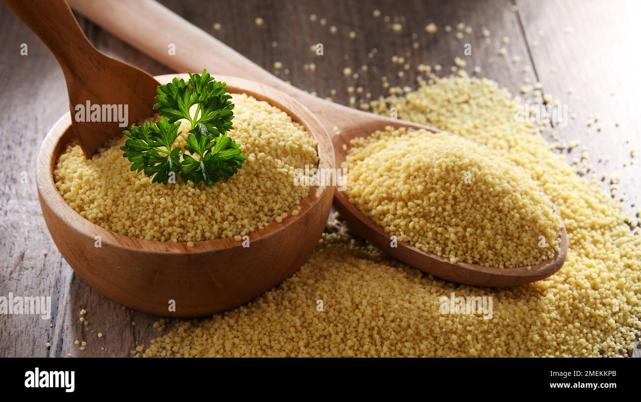Composition with uncooked couscous. Stock Photo