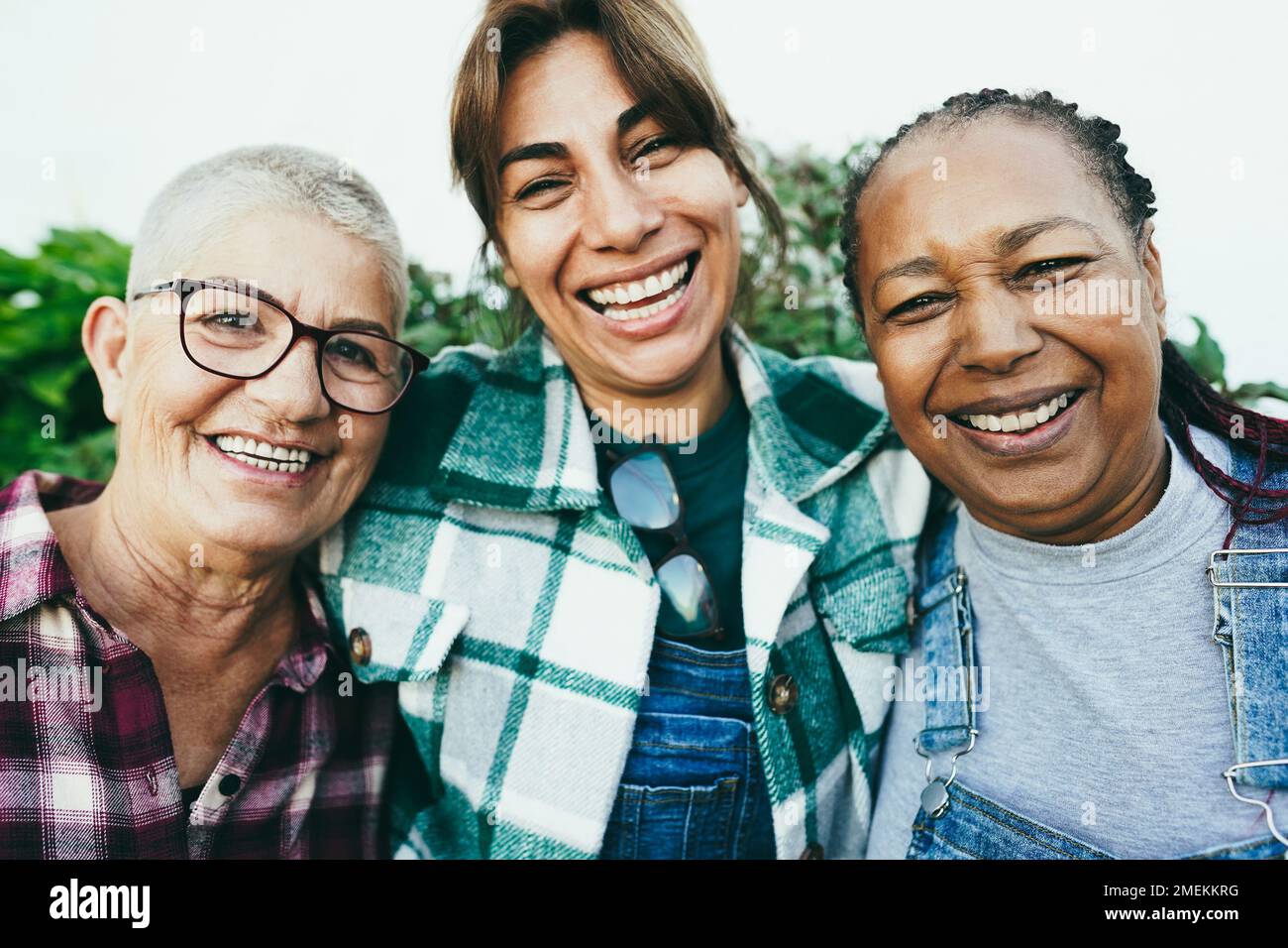 Multiracial senior women having fun together outdoor - Focus on african female face Stock Photo