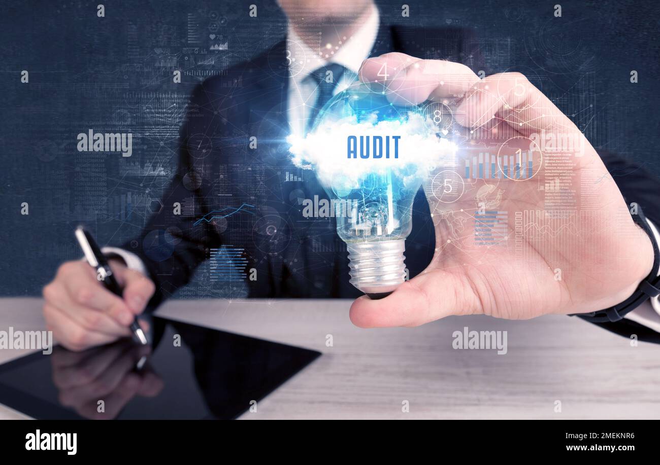 Businessman holding a light bulb, business concept Stock Photo - Alamy