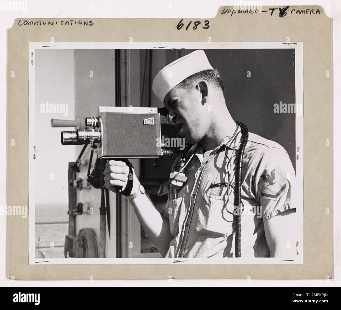 A Coast Guardsman operates a portable TV camera aboard a ship ...