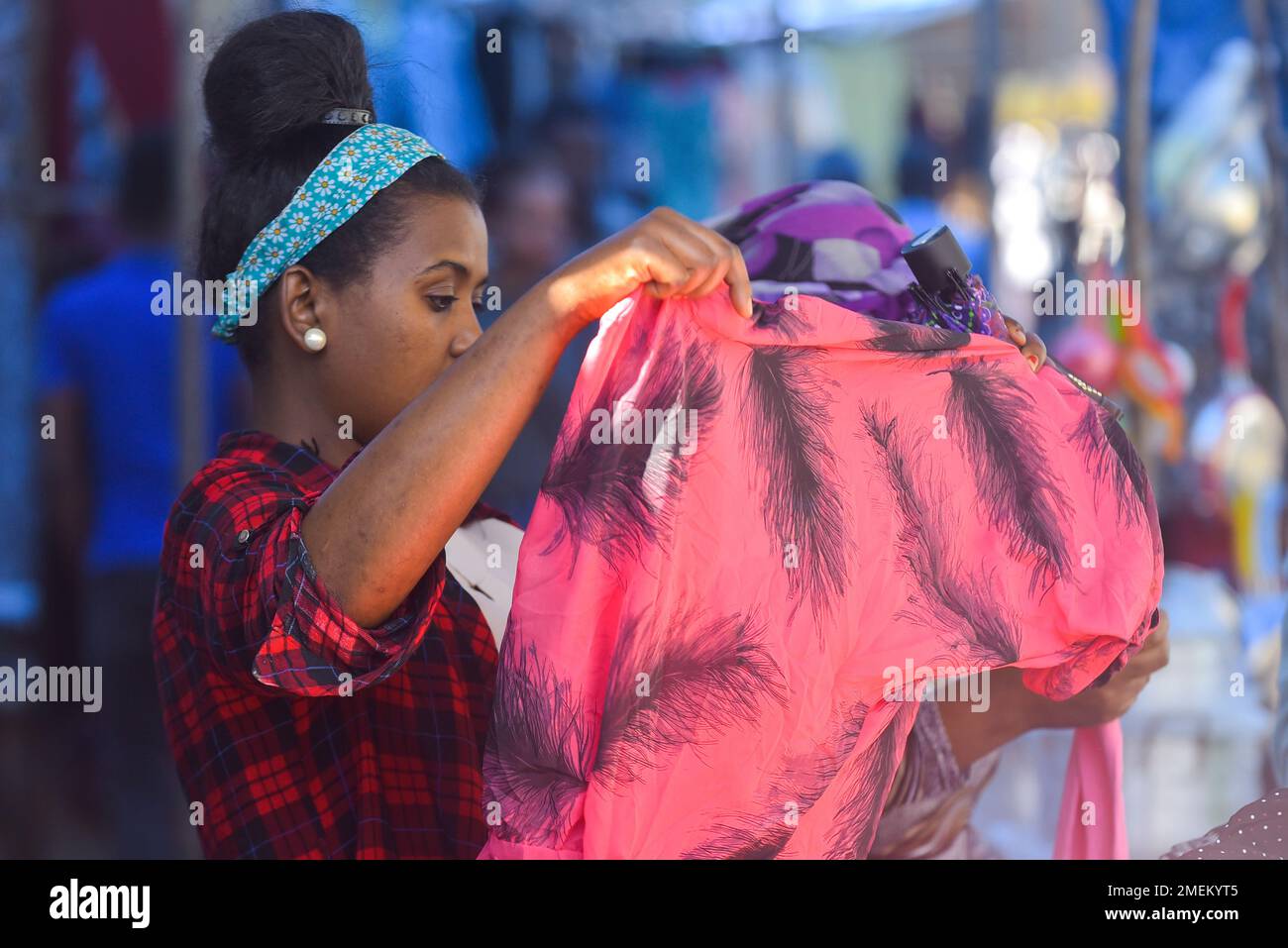 Addis Ababa, Ethiopia. 14th Jan, 2023. A woman selects clothes at a