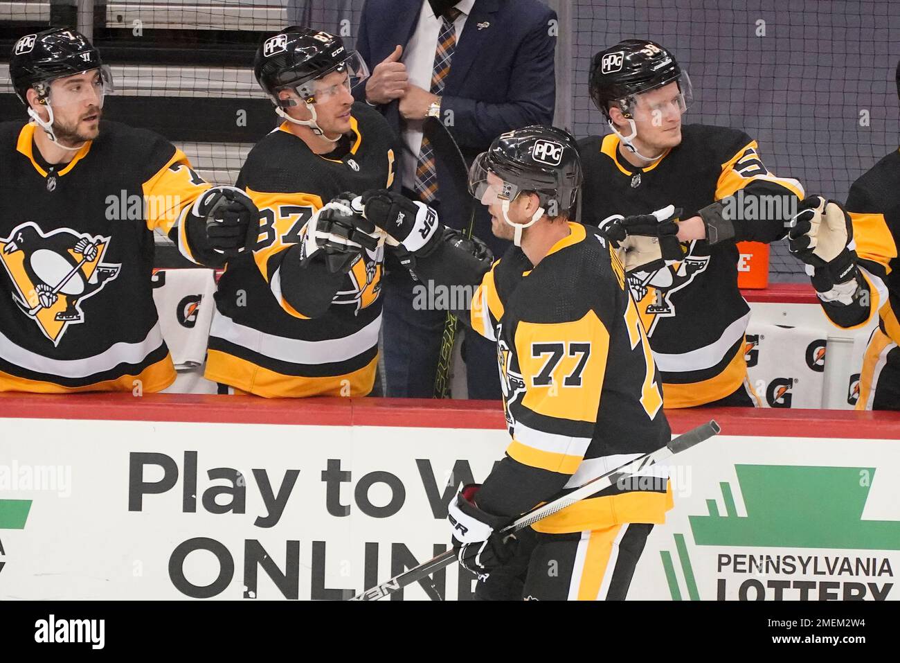 Pittsburgh Penguins Jeff Carter (77) returns to the bench after scoring during the first period of an NHL hockey game against the New Jersey Devils in Pittsburgh, Tuesday, April 20, 2021