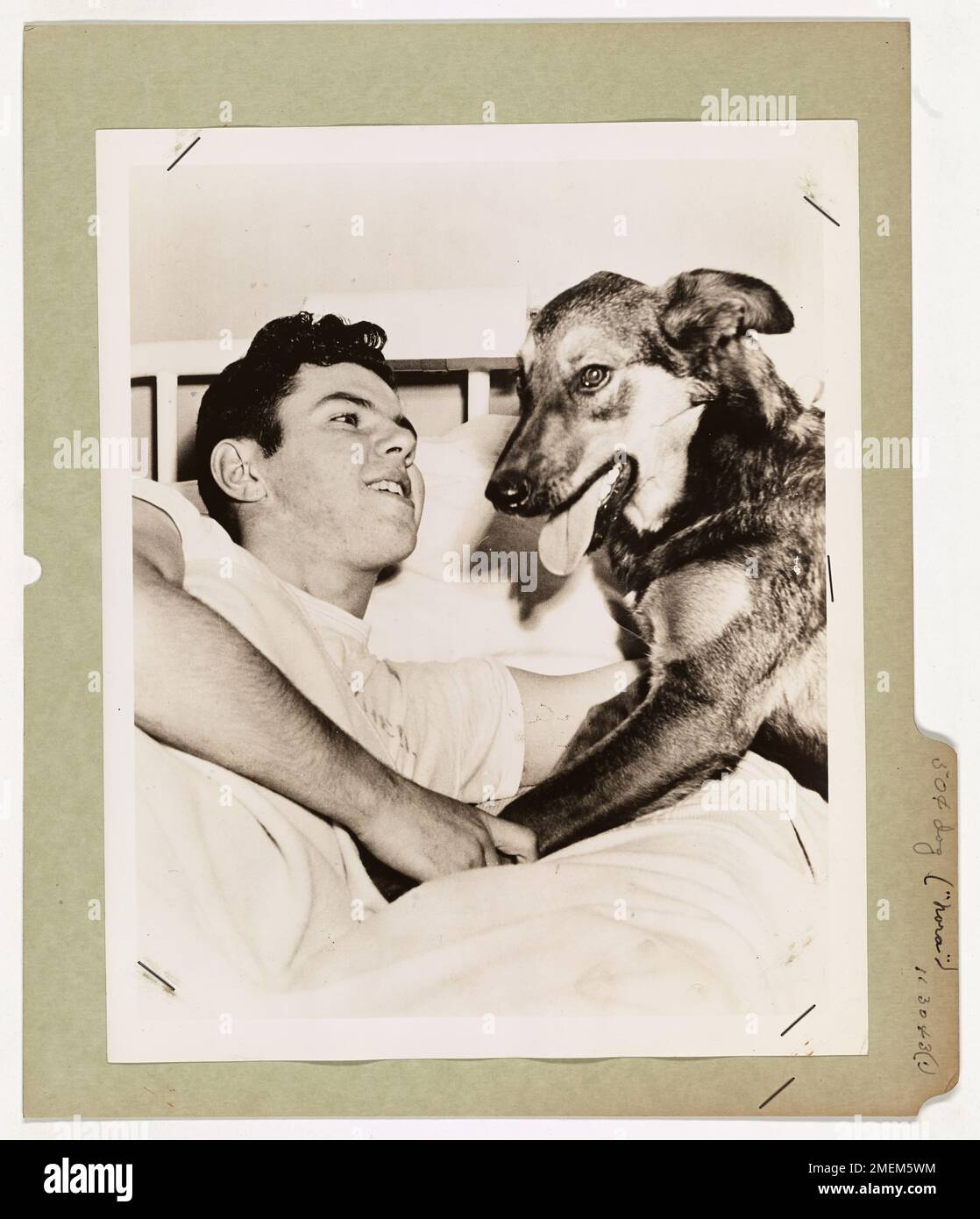 Fifty Cent Dog Saves Coast Guardsman's Life. Coast Guardsman Evans E