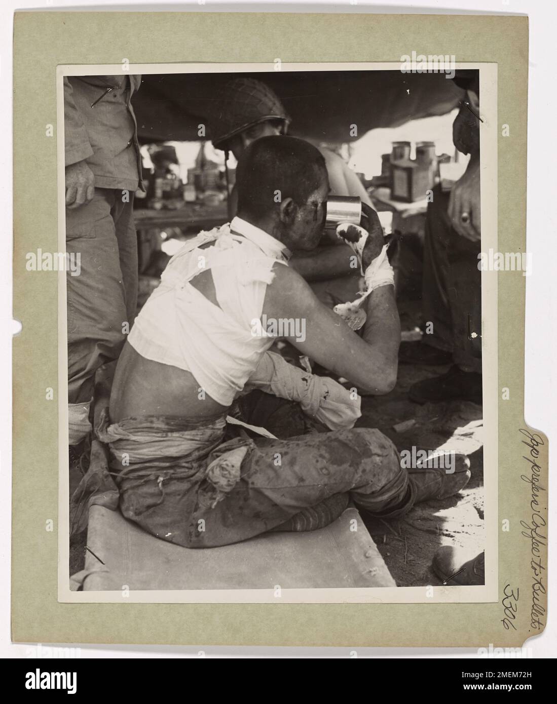 Photograph of Japanese Prisoner Drinking Coffee. Jap Prefers Yankee