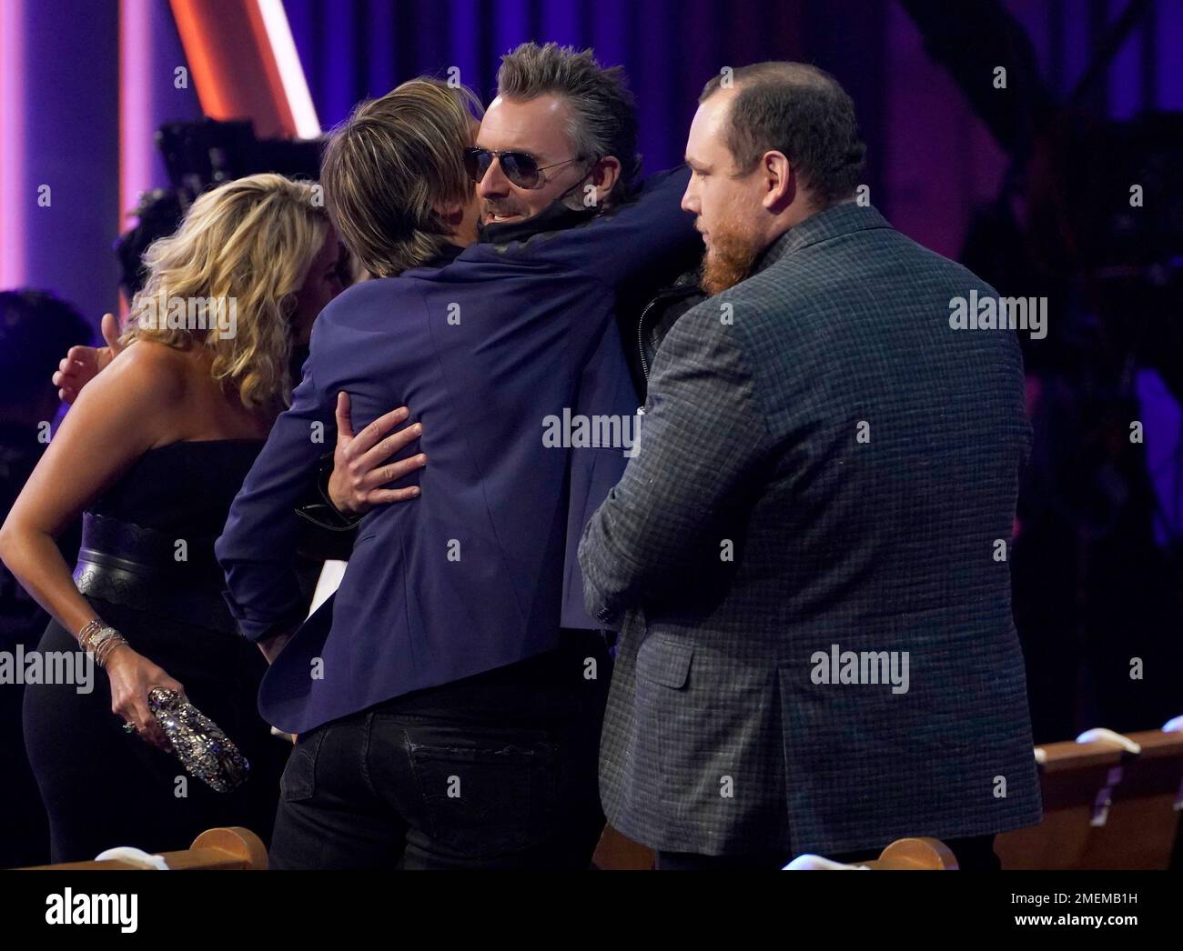 Keith Urban, from left, Eric Church and Luke Combs speak in the