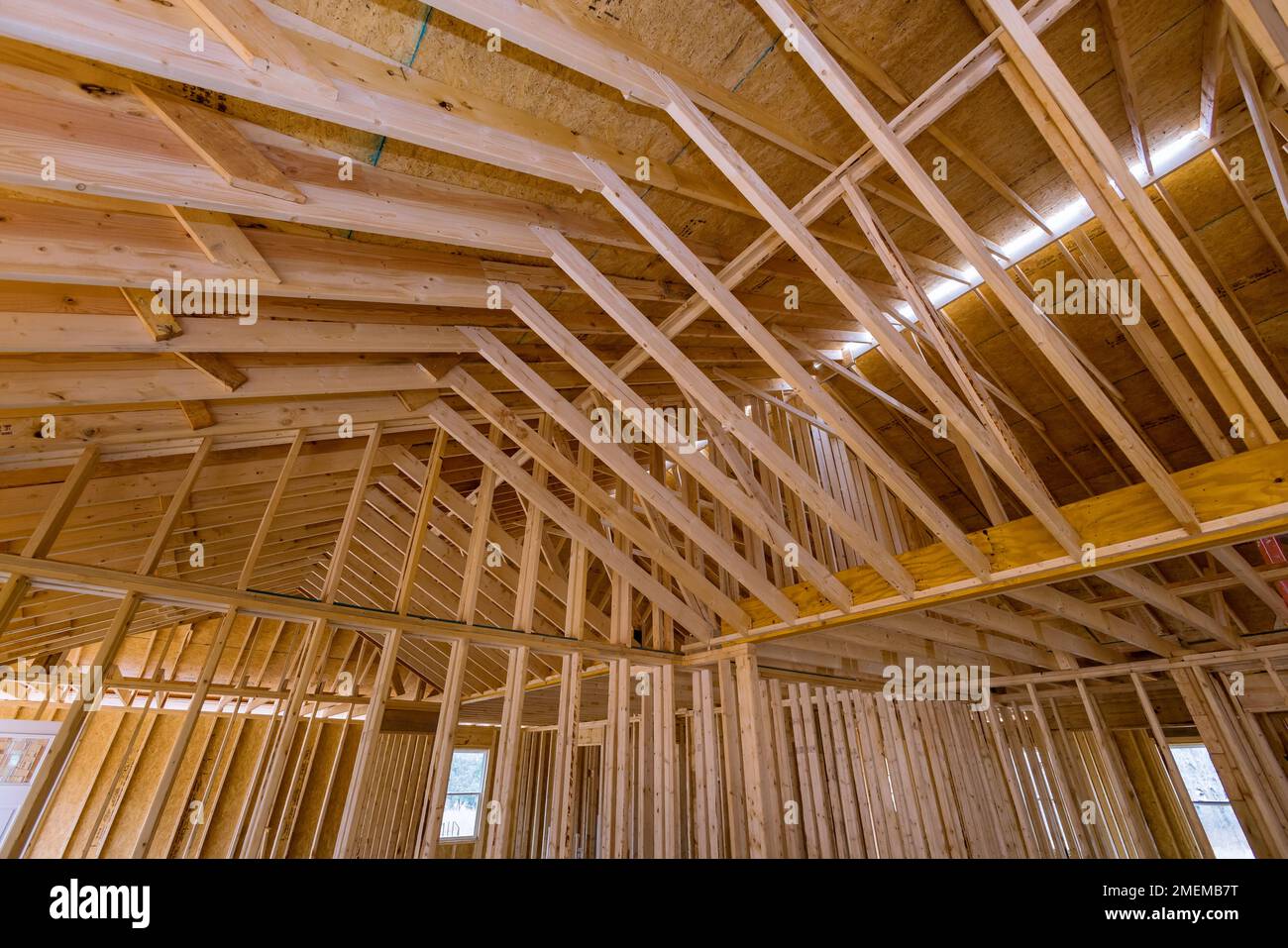 Framing for interior of truss beams frame system new house under construction Stock Photo