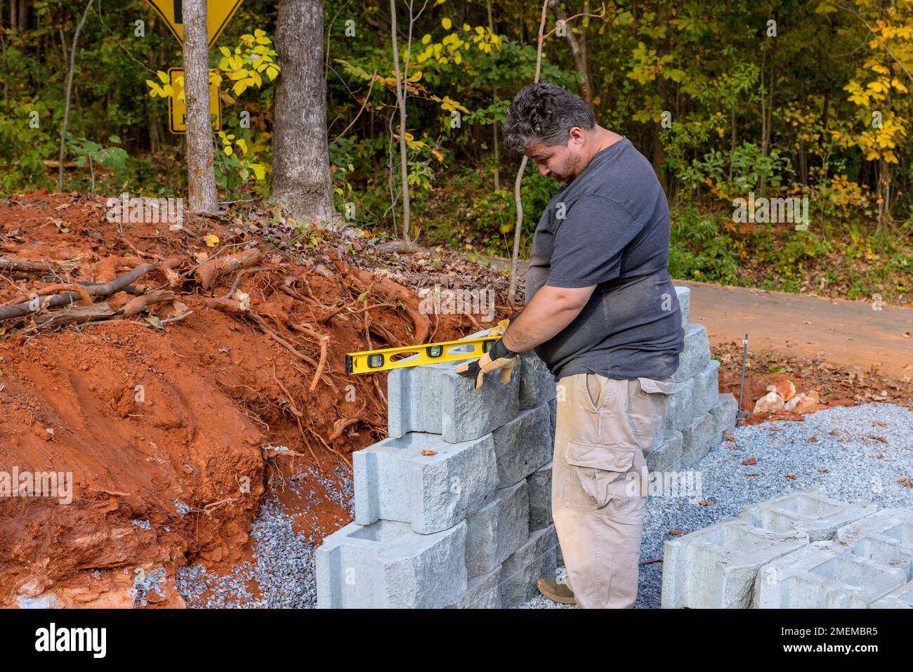 An contractor was installing concrete block after leveling walls on