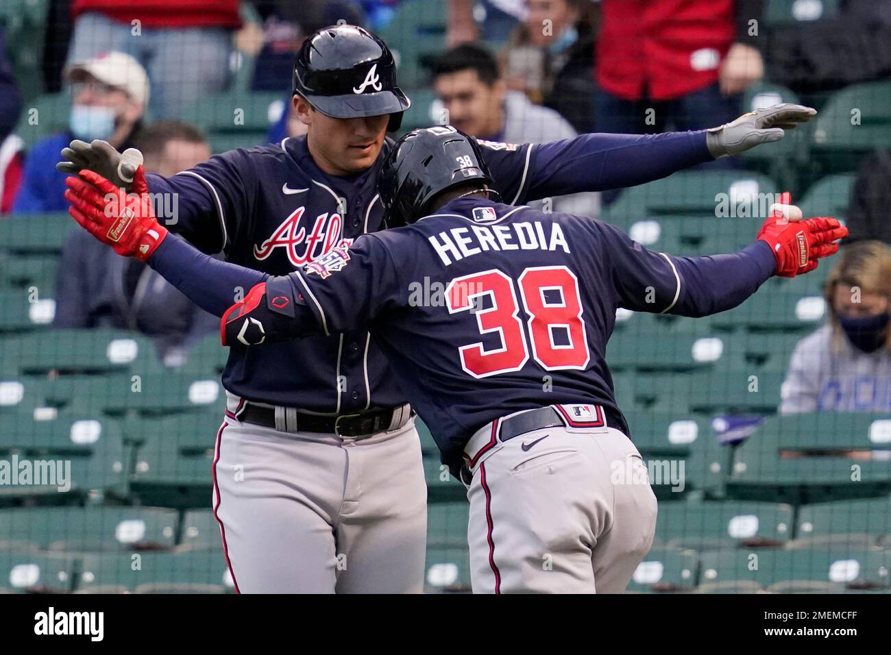 Atlanta Braves' Guillermo Heredia (38) celebrates with Atlanta Braves'  Austin Riley after hitting a two-run home run during the first inning of a  baseball game against the Chicago Cubs in Chicago, Sunday