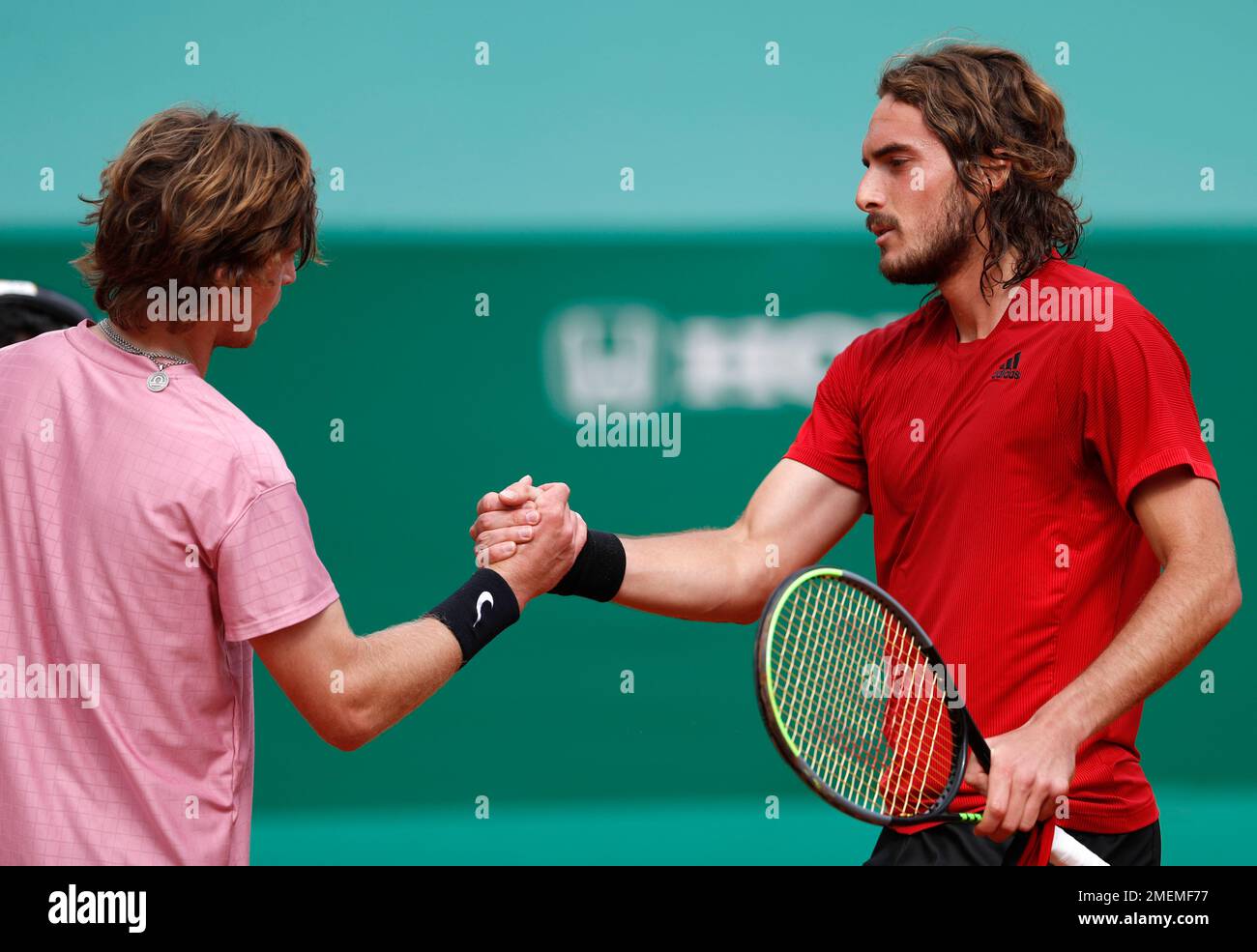 Stefanos Tsitsipas right of Greece shake hands with Andrey