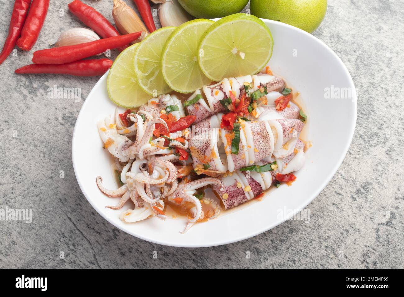 Steam Squid with Spicy Chili and Lime Sauce Thai street food Stock
