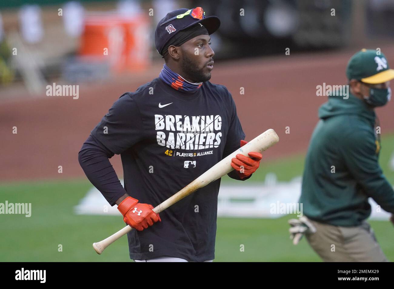 Detroit Tigers' Akil Baddoo wears a shirt to honor Jackie Robinson Day  during batting practice before a baseball game between the Oakland  Athletics and the Tigers in Oakland, Calif., Thursday, April 15