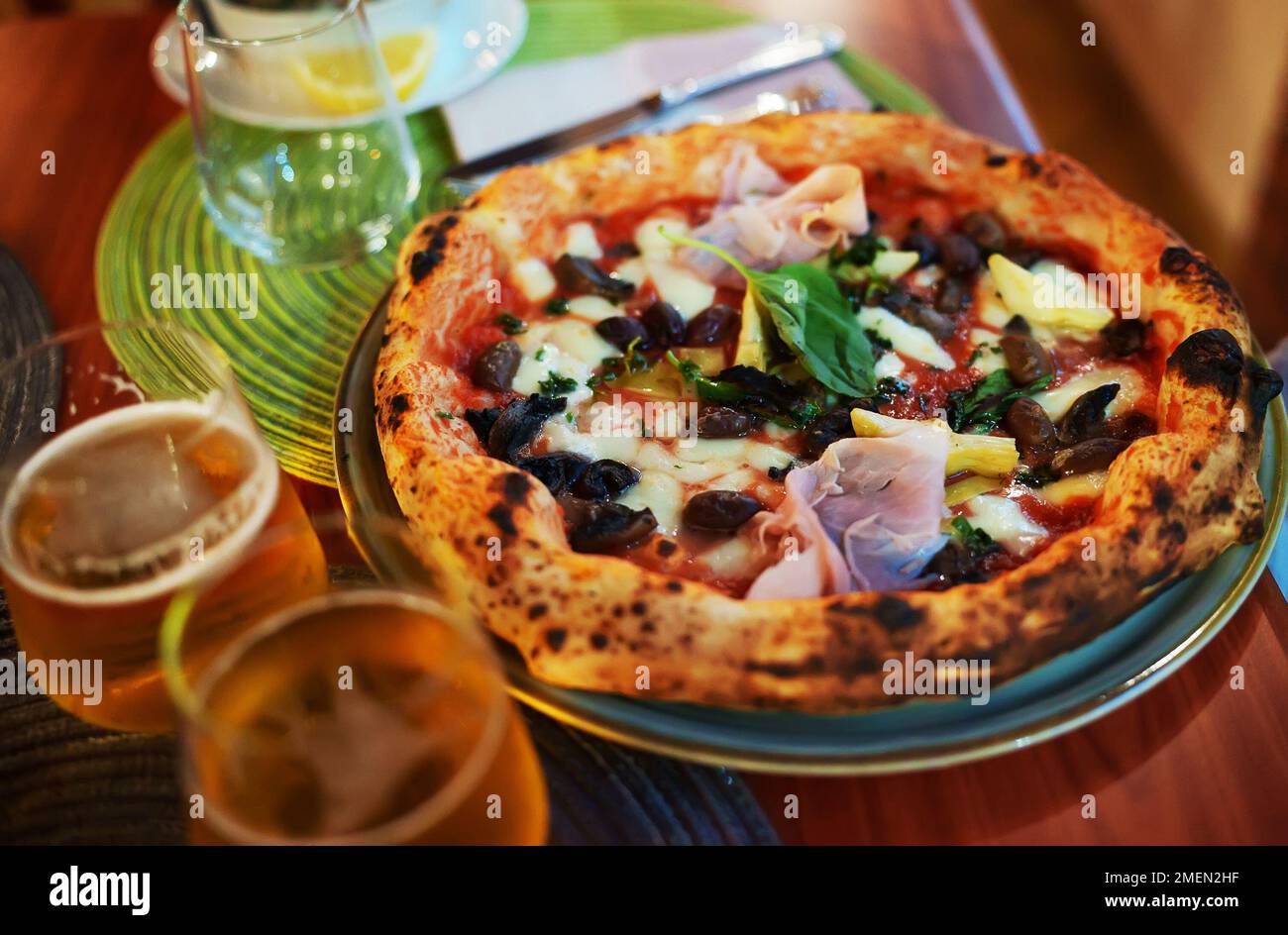 Pizza capricciosa. Pizza with ham, olives, mushrooms and artichokes