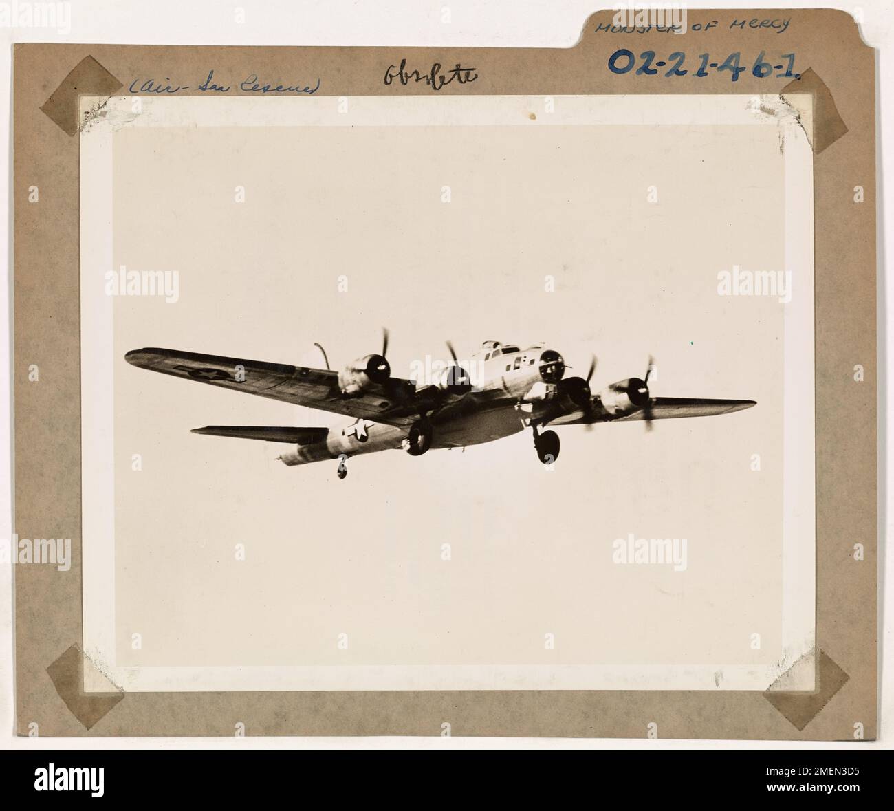 A Coast Guard B-17 bomber equipped with a lifeboat, capable of being parachuted into the water for rescue missions. The aircraft serves as part of air-sea rescue operations during WWII. Stock Photo