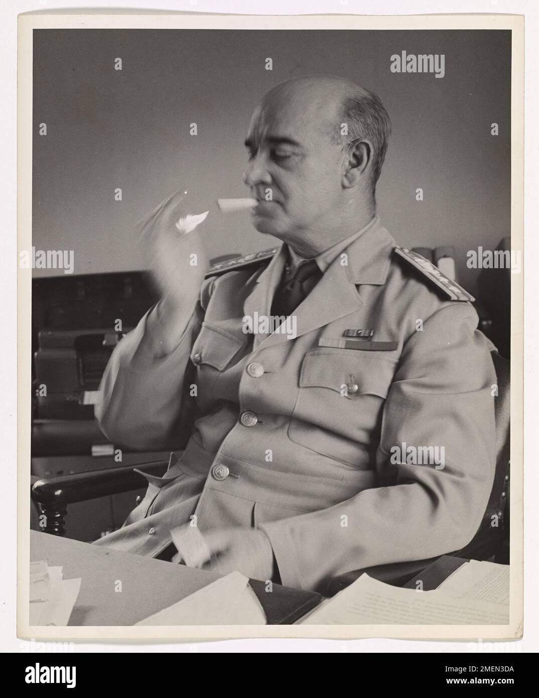 Admiral Gorman lighting a cigarette. Stock Photo