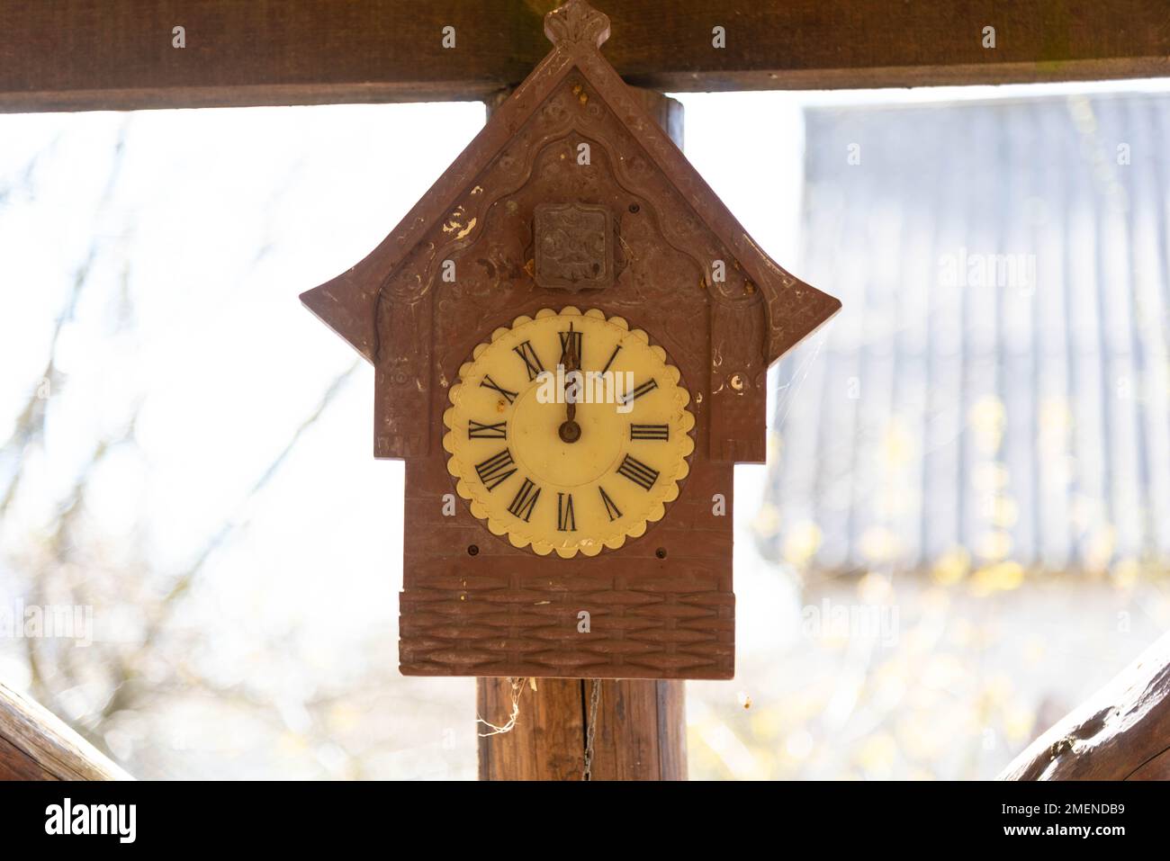 Old rustic clock on a light background. Stock Photo