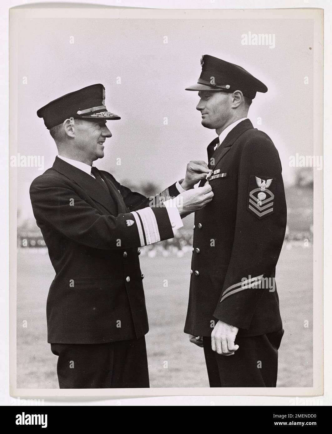 Chief Electrician's Mate John T. Hendrix of the U.S. Coast Guard was awarded the Navy and Marine Corps Medal for heroism in the rescue of 144 crew members from a stricken merchant ship in the North Atlantic in 1943. Hendrix's bravery under harsh conditions earned him the prestigious decoration for his exceptional service during convoy and anti-submarine duty. Stock Photo