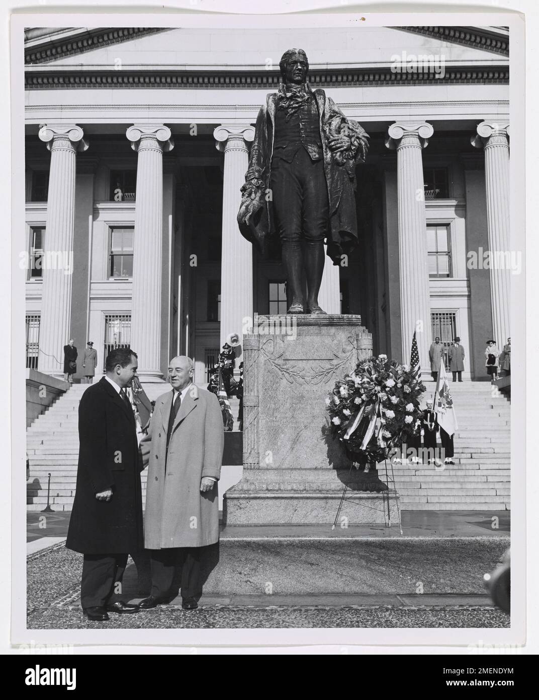 George M. Humphrey and Richard M. Nixon on Opening Day of Alexander Hamilton Bicentennial in Washington, DC. Picture shows George M. Humphrey and Richard Nixon by Alexander Hamilton statue in front of U.S. Treasury Building in Washington, DC. Stock Photo