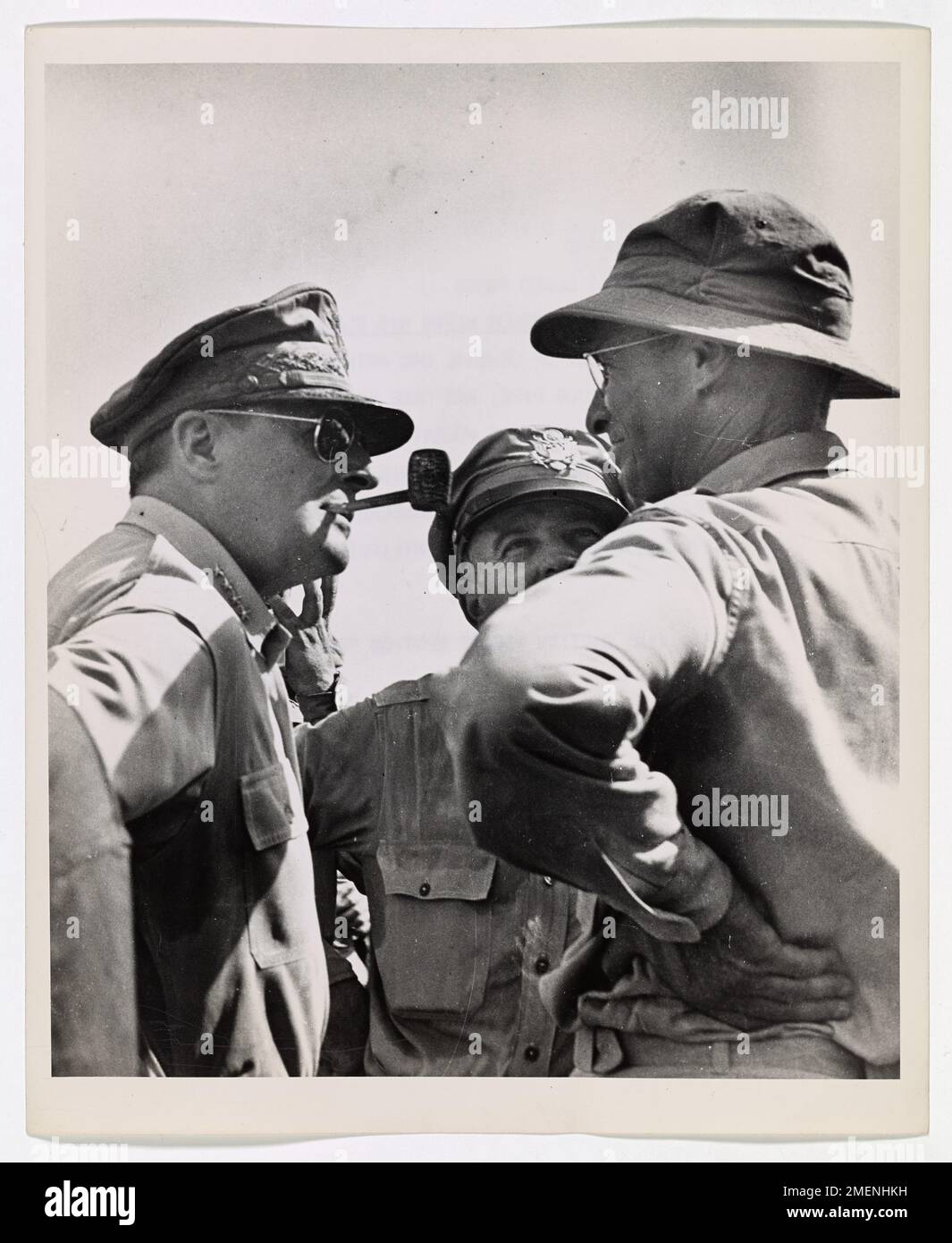 MacArthur Keeps His Pledge. This remarkable study of General MacArthur, nonchalantly puffing on his corncob pipe, was made by a Coast Guard combat photographer at the historic moment when Mac Arthur surveyed the Leyte Island beachhead and saw his famous 'I will Return' pledge fulfilled. Stock Photo