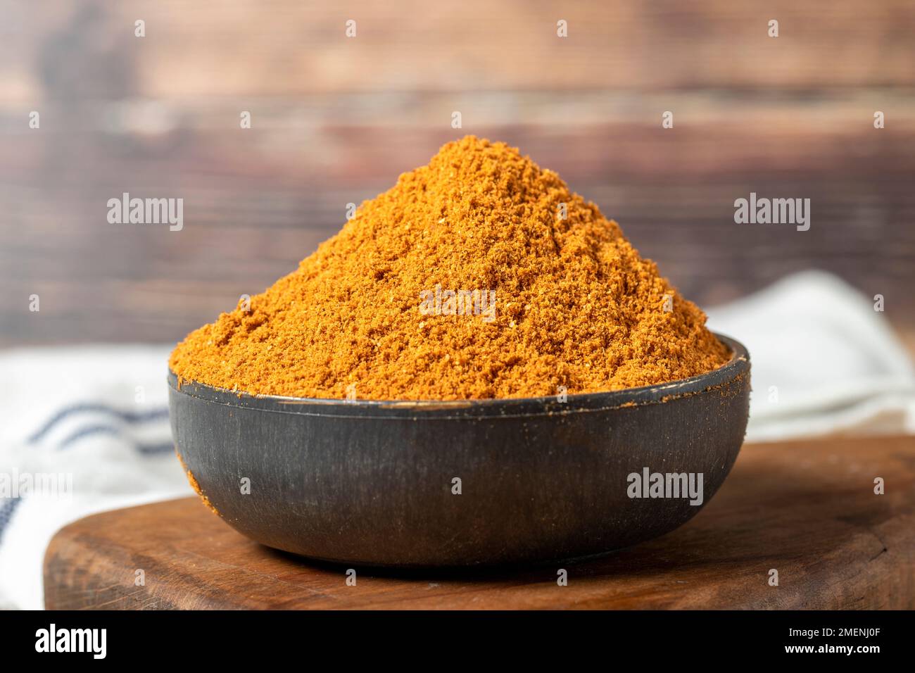 Meatball spice in bowl on rustic table. Meatball seasoning is a spice