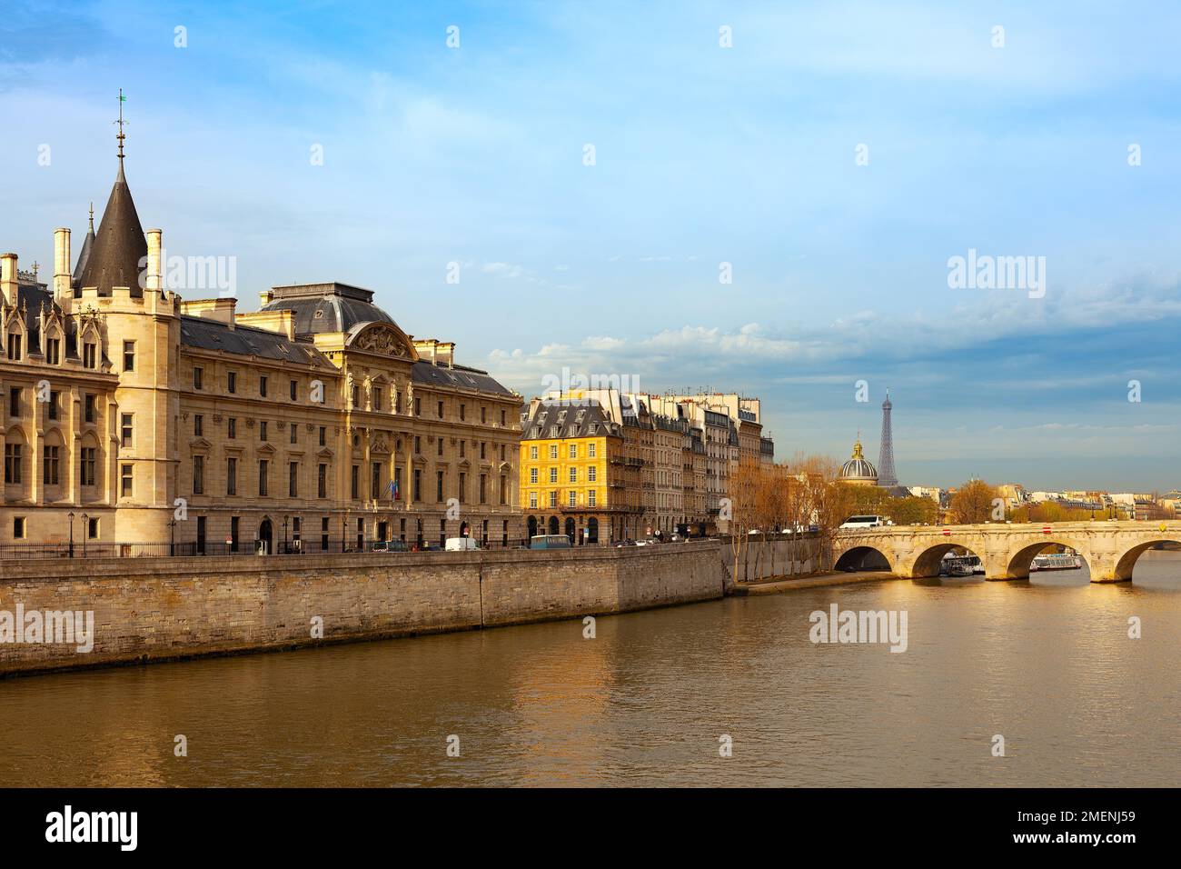 The Conciergerie at Justice Palace and Pont Neuf Bridge over the Seine River, Ile de la Cite, Paris, France Stock Photo